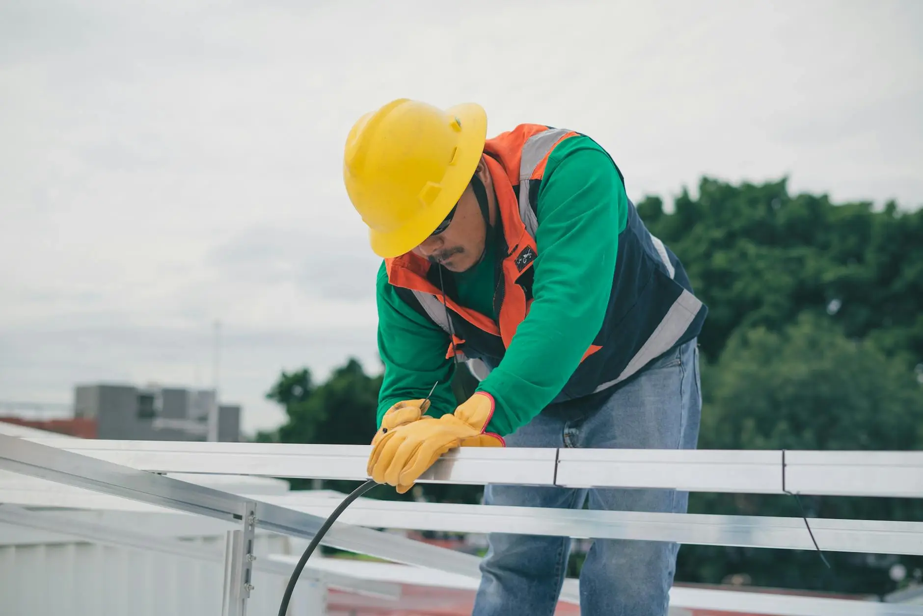 A detailed close-up of high-quality architectural shingles being installed on a roof deck during a replacement project in Hillview.