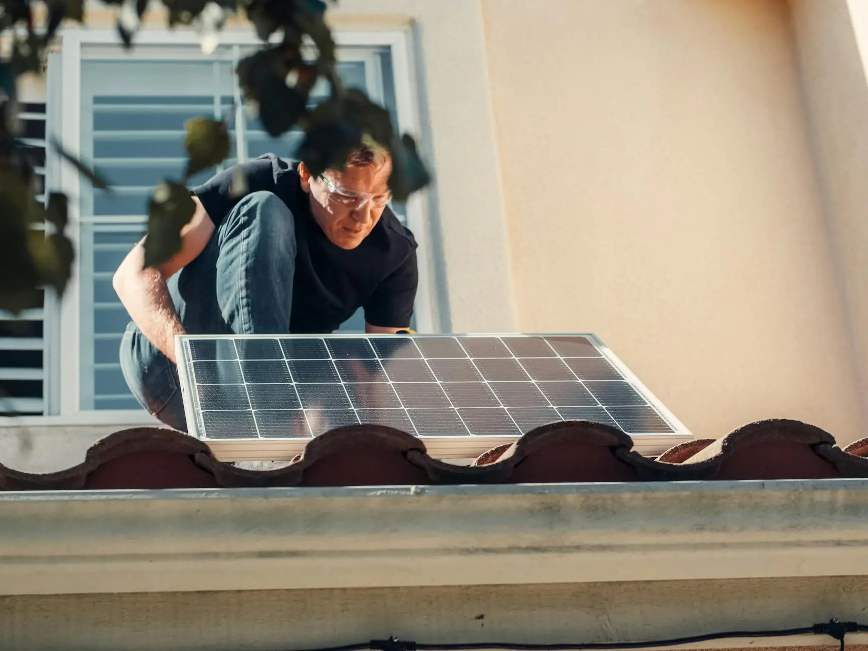 A close-up of high-quality asphalt shingles being meticulously aligned and nailed down by a professional roofer.